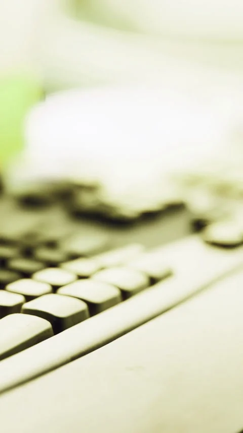 Keyboard and workspace setup highlighting technology in a dimly lit environment Stock Footage 326318024
