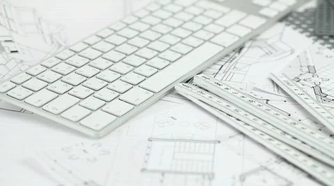 Keyboard & architectural plans Stock Footage