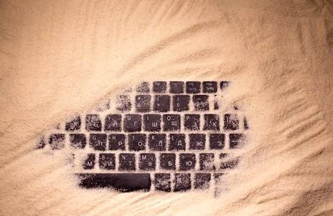 Keyboard in the beach sand Stock Photos