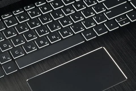 Keyboard black notebook close-up. With white letters. Stock Photos