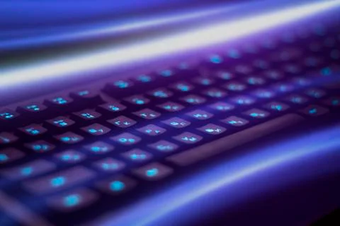 Keyboard with blue backlight. rays of blue light Stock Photos