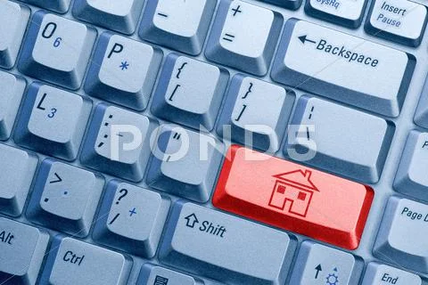 Keyboard button with house icon Stock Photos