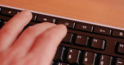 Keyboard button to turn off a computer Stock Footage 130037178