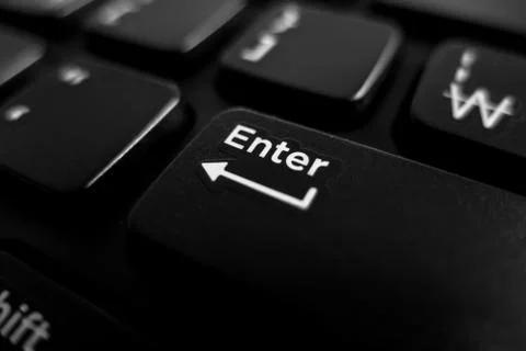 Keyboard close up focus in enter key Stock-Fotos