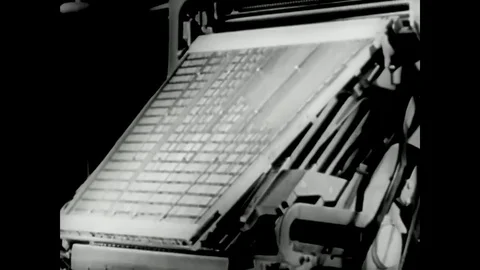 A keyboard composing machine has a magazine, an escapement, key rods, an Vídeos de archivo 79515657