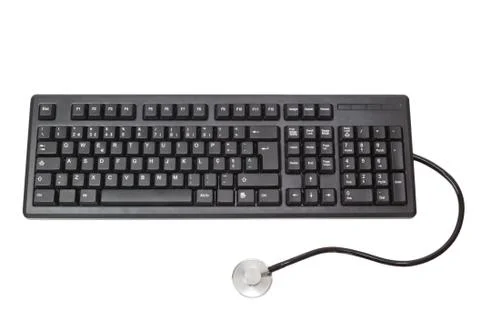 The keyboard for the computer and stethoscope. On a white background. Stock Photos