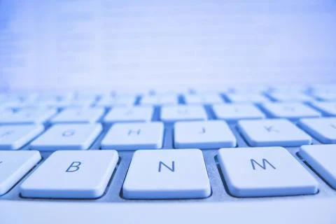 The keyboard of a computer in front of a screen. Data processing and Internet Foto stock