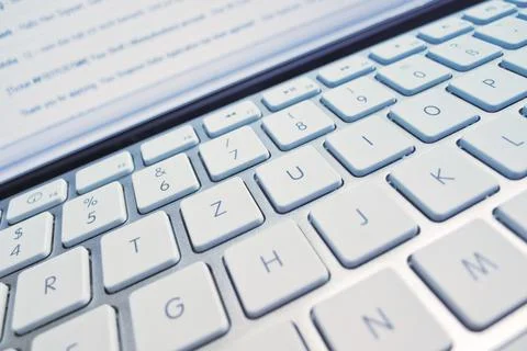 The keyboard of a computer in front of a screen. Data processing and Internet 写真素材