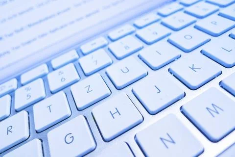 The keyboard of a computer in front of a screen. Data processing and Internet Foto stock