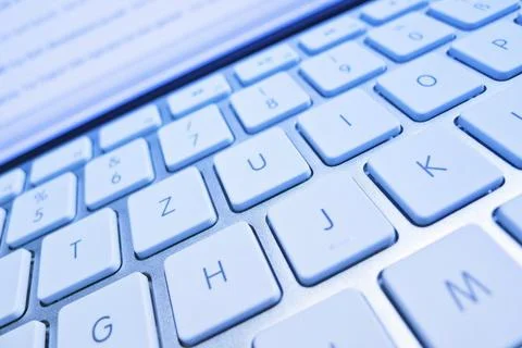 The keyboard of a computer in front of a screen. Data processing and Internet Foto stock
