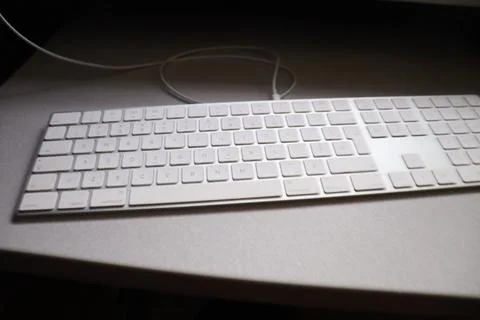 A keyboard on a desk Stock Photos