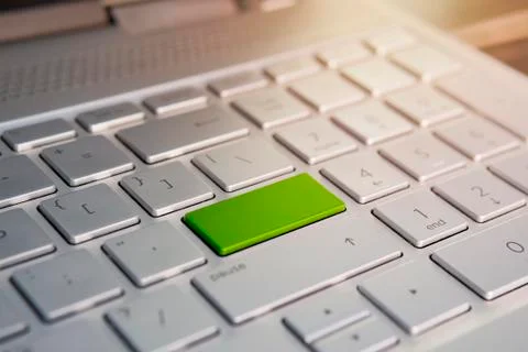 Keyboard with green blank Enter button modern pc text communication board, Co Stock Photos