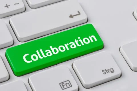 A keyboard with a green button - Collaboration Stock Photos