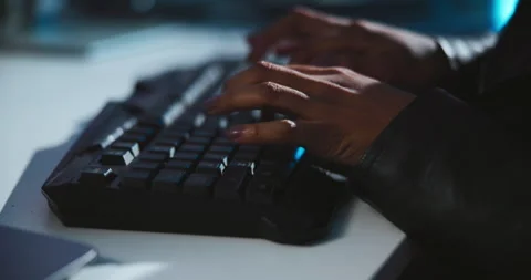 Keyboard, hands and hacker in office at night working on programming for malware Stock Footage 309817088