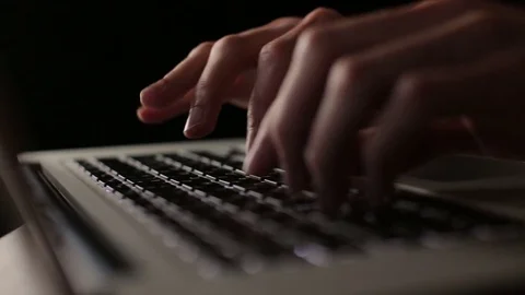 Keyboard input typing - close up man hands laptop using black background Stock Footage 82914347