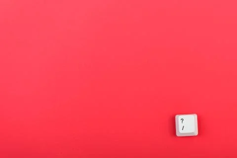 Keyboard key with question mark isolated. White keyboard key on red background.  Stock Photos