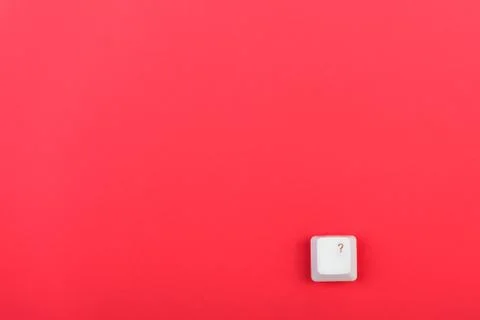  Keyboard key with question mark isolated. White keyboard key on red background. Stock Photos
