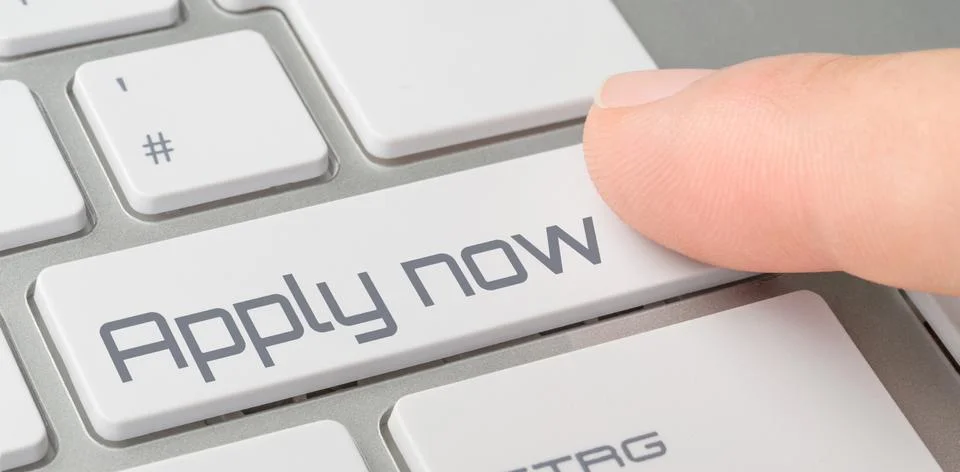 A keyboard with a labeled button - Apply now Stock Photos