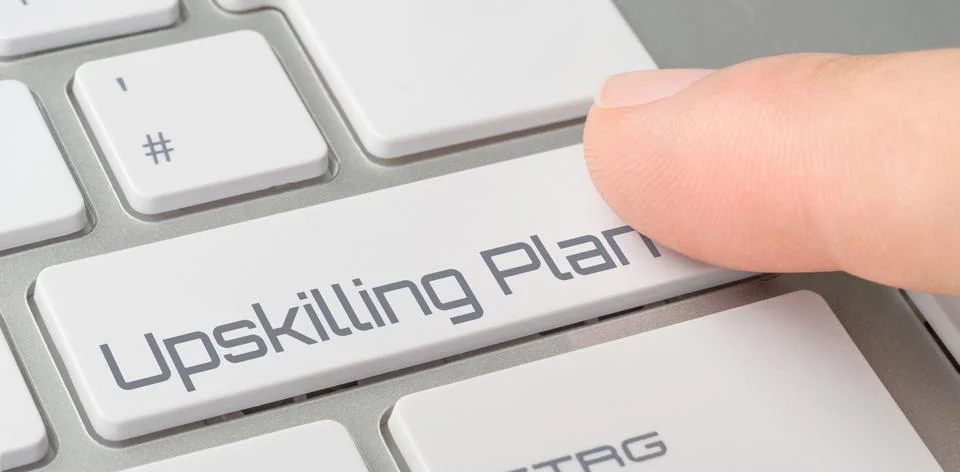 A keyboard with a labeled button - Upskilling Plan Stock Photos