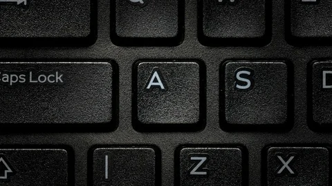 Keyboard Letters closeup macro. Camera handheld and moves slowly. Vídeos de archivo 117872410