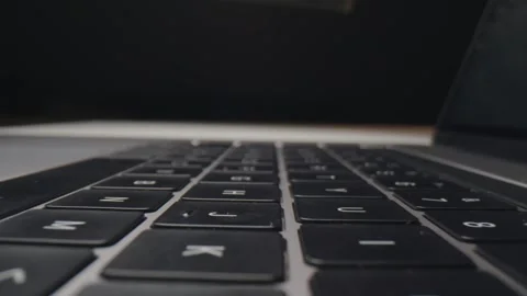 Keyboard Macro Lens View of a Modern Laptop Computer in Dark Workspace 库存影片 331100804