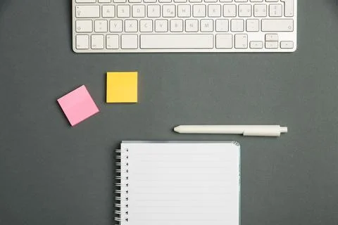 Keyboard Over A Table Beside A Notebook And Pens With Sticky Notes. Computer Stock Photos