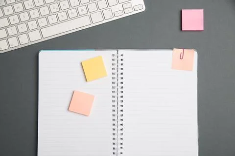 Keyboard Over A Table Beside A Notebook And Pens With Sticky Notes. Computer Stock Photos