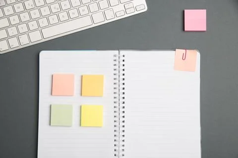 Keyboard Over A Table Beside A Notebook And Pens With Sticky Notes. Computer Stock Photos
