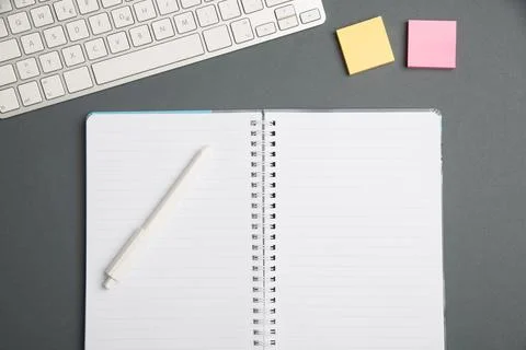 Keyboard Over A Table Beside A Notebook And Pens With Sticky Notes. Compute.. Stock Photos
