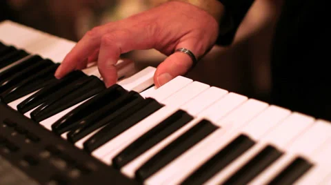 Keyboard player with a band Stock Footage 36478481