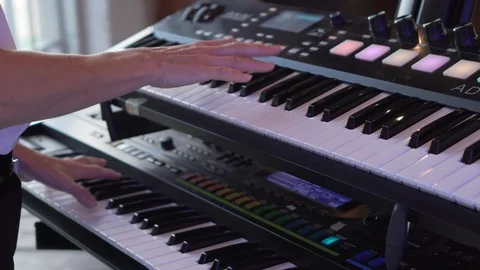 Keyboard player playing synthesizer close-up Stock Footage 99595627