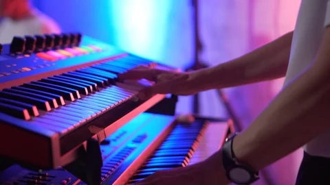 Keyboard player playing synthesizer close-up Stock Footage 99597044