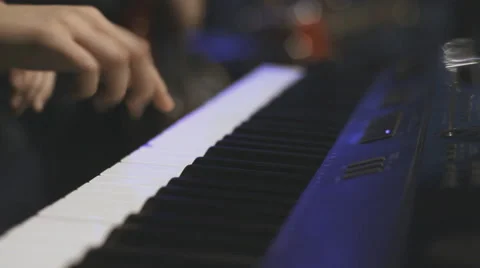 Keyboard player playing on synthesizer Stock Footage 62314708