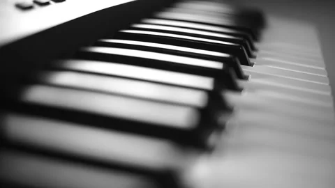 Keyboard playing  black and white professional cinematic Stockbeeldmateriaal 134608334