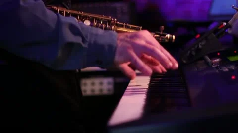 Keyboard playing with changing lighting Stock Footage 11135053