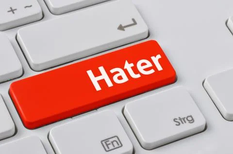 A keyboard with a red button - Hater Stock Photos