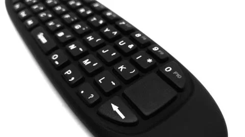 Keyboard remote control and Space for putting your mark. Stock Photos