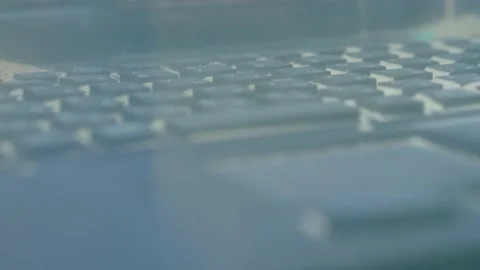 Keyboard of rugged laptop computer during dust resistance test - close up Stock Footage 132875645