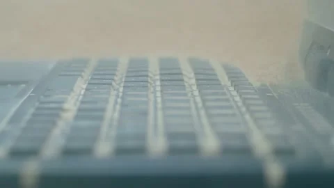 Keyboard of rugged laptop computer during dust resistance test - close up Stock Footage 135519526