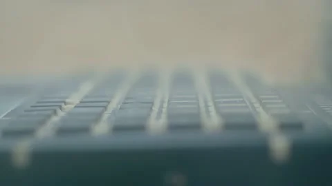 Keyboard of rugged laptop computer during dust resistance test - close up Stock Footage 136483555