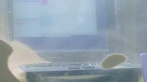 Keyboard of rugged laptop computer during dust resistance test - close up Stock Footage 149009604