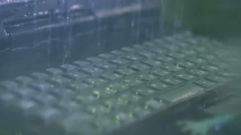 Keyboard of rugged laptop computer during water resistance test - close up Stock Footage 149009612