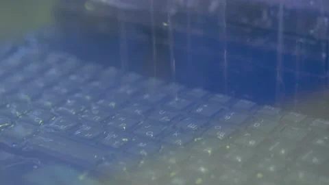 Keyboard of rugged laptop computer during water resistance test - close up Stock Footage 163342498
