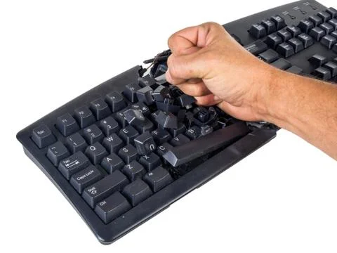 Keyboard smashed by angry user Stock Photos