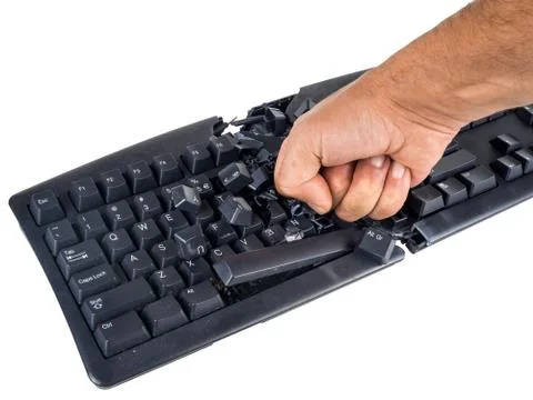Keyboard smashed by angry user Stock Photos