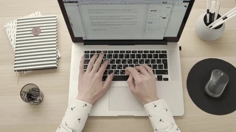Keyboard typing hands. Freelancer workspace top view Stock Footage 83417460