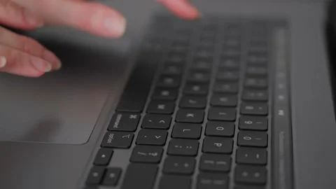 Keyboard typing. Online freelancing. Working on a laptop Stock-Footage 169096636