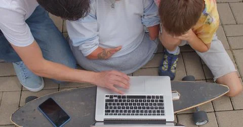 Keyboard use, computer application. Help man without hands. Stock Photos