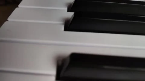 Keyboard with white and black keys in slow motion Stock Footage 170707750