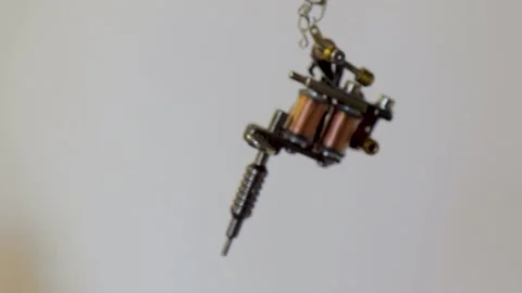 Keychain in the form of a tattoo machine Stock Footage 168375384